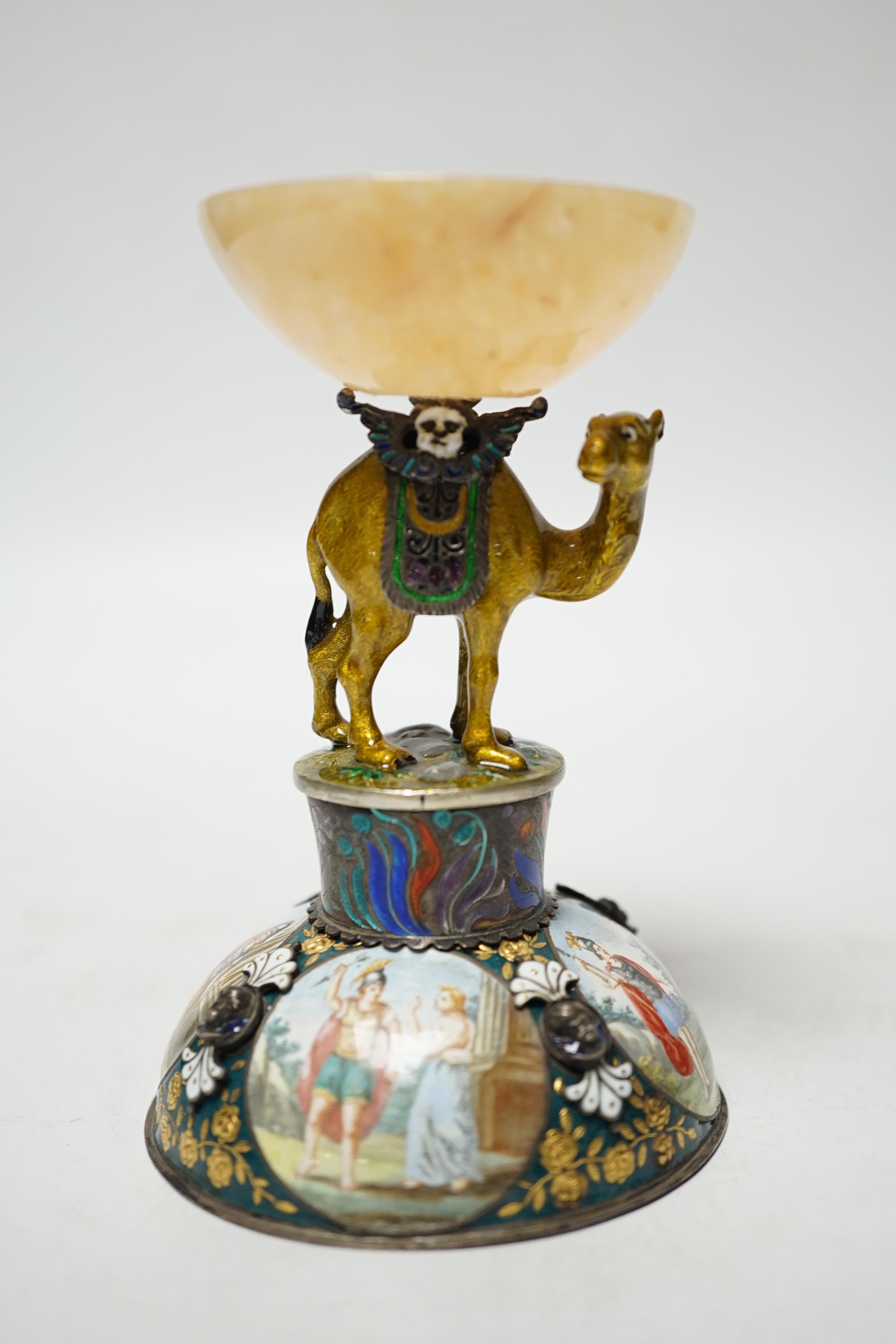 A 19th century Viennese? white metal, polychrome enamel and onyx mounted small centrepiece decorated with figural scenes, the stem in the form of a camel, height 10.7cm.